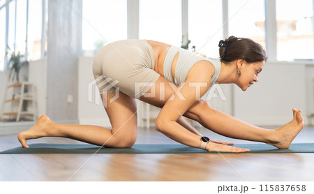 Different yoga poses performed by a slender girl in gym Different yoga poses performed by a slender girl in gym 115837658