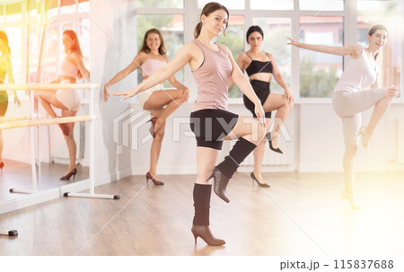 Young female dancer in heels practicing jazz-funk in studio 115837688