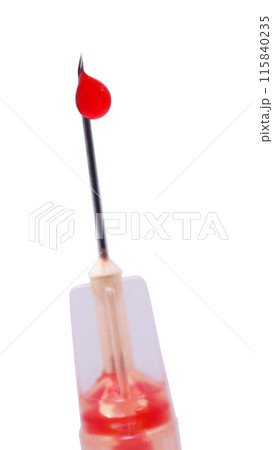 1 ml syringe filled with fake blood and a drop on needle isolated on white background 115840235