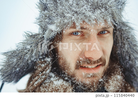 a bearded man in an earflap in winter 115840440