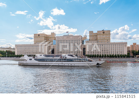 View of the Ministry of Defence of Russian Federation, and Moscow river embakment with cruise ships at sunset. 115841515