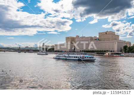 View of the Ministry of Defence of Russian Federation, and Moscow river embakment with cruise ships at sunset. 115841517