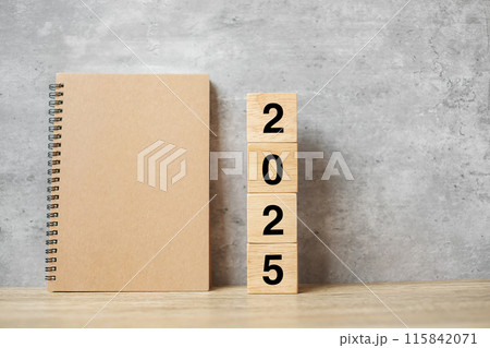 2025 Happy New Year with blank notebook and wooden number. countdown, Resolution, Goals, Plan, Action and Mission Concept 115842071