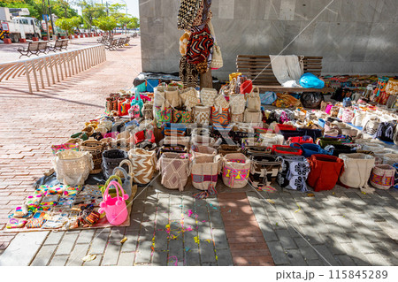 Colorful handmade bags at a vibrant street market. Santa Marta, Colombia Colorful handmade bags at a vibrant street market. Santa Marta, Colombia 115845289