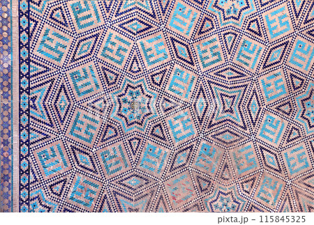 Vertical or horizontal background with detail of ancient mosaic walls with clay details and geometric ceramic tile ornament. Traditional iranian tile decorations 115845325