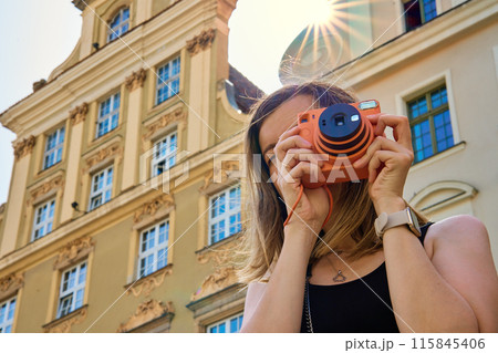 Woman Traveler Photographing Historic European Architecture 115845406