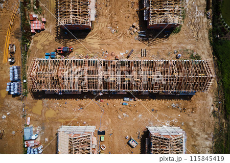 Aerial view of new house construction project in suburban area. Aerial view of new house construction project in suburban area. 115845419