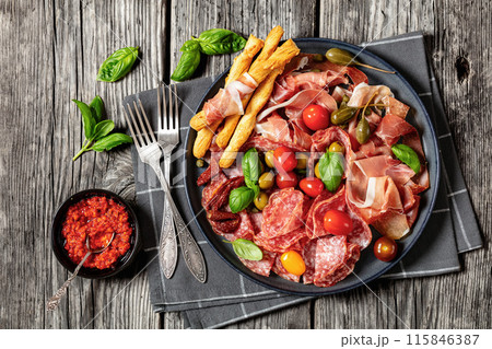 italian antipasto plate of cured meat and veggies italian antipasto plate of cured meat and veggies 115846387