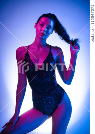 Seductive Woman In Lace Bodysuit Posing In Neon Lights Seductive Woman In Lace Bodysuit Posing In Neon Lights 115847073