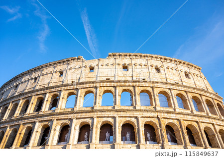 Close-up of the iconic Roman Colosseum with arches and weathered stone facade, capturing the grandeur of this historic amphitheater. Rome, Italy Close-up of the iconic Roman Colosseum with arches and weathered stone facade, capturing the grandeur of this historic amphitheater. Rome, Italy 115849637