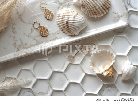Seashell Earrings on White Hexagon Tile Background With Eucalyptus Seashell Earrings on White Hexagon Tile Background With Eucalyptus 115850105