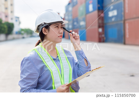 Asian Customs worker Thinking gesture work in logistic industry. Port officer working in shipping container yard. Asian Customs worker Thinking gesture work in logistic industry. Port officer working in shipping container yard. 115850700