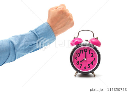 Alarm clock and man hand in fist isolated on white. The concept of a bad dream 115850738
