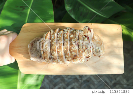 bread , whole wheat bread or sourdough bread or loaf of bread or cranberry and whole grain bread in the tray 115851883