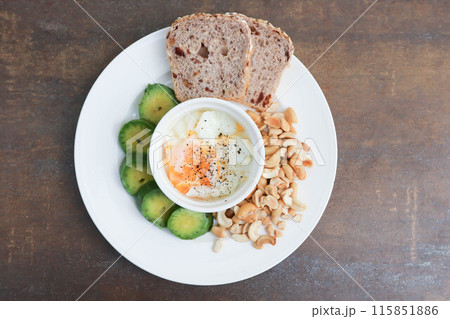whole wheat bread or sourdough bread with nuts and soft boiled egg 115851886