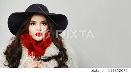 Retro styled young adult woman fashion model with bright make-up and long wavy hair Retro styled young adult woman fashion model with bright make-up and long wavy hair 115852072