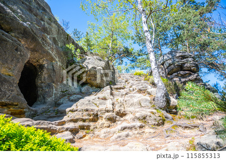 The Drabovna sandstone carved chamber near Kozakov Mountain in Czechias Bohemian Paradise is a must-see for hikers and nature lovers. The Drabovna sandstone carved chamber near Kozakov Mountain in Czechias Bohemian Paradise is a must-see for hikers and nature lovers. 115855313