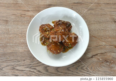 fried salt crispy chop chicken meat dreading garlic and pepper gravy sauce on plate  115855960