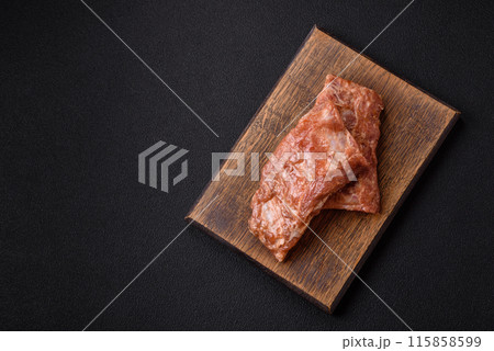 Raw pork or beef ribs in honey sauce with salt, spices 115858599