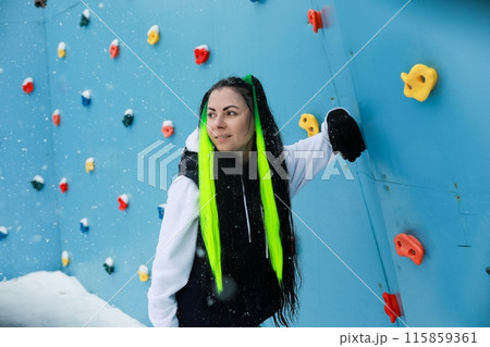 Woman With Long Hair in Black Vest and Yellow Hair Standing Woman With Long Hair in Black Vest and Yellow Hair Standing 115859361