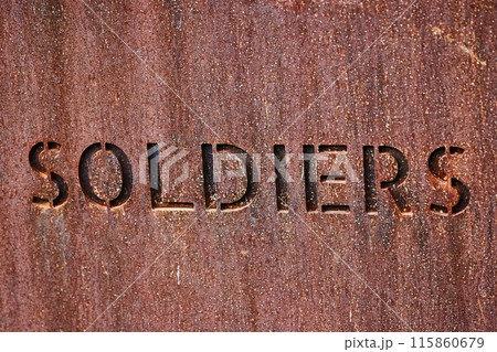Soldiers word writen on metal plaque 115860679