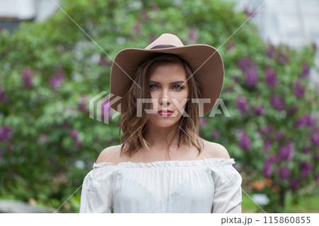 Cute healthy woman posing outdoor in spring park, closeup portrait Cute healthy woman posing outdoor in spring park, closeup portrait 115860855