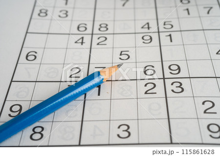 Sudoku puzzle game playing to challenge brain. 115861628