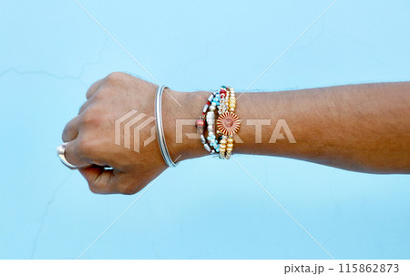 Brother showing rakhi on his hand on an occasion of Raksha Bandh Brother showing rakhi on his hand on an occasion of Raksha Bandh 115862873