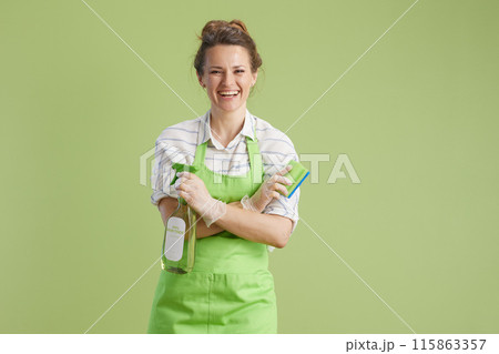 smiling modern female isolated on green background 115863357