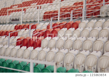 Colorful stadium seats in vibrant patterns, creating an inviting seating arrangement 115863654