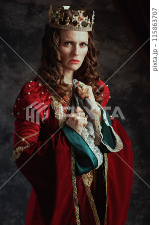 furious medieval queen in red dress with handkerchief furious medieval queen in red dress with handkerchief 115863707