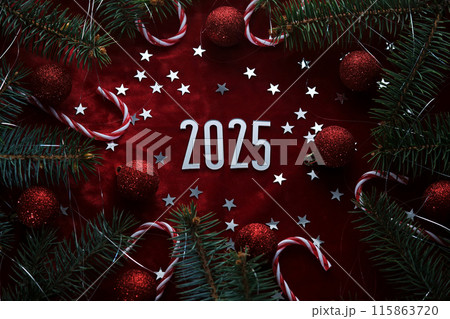 New Year red 2025 background. Number of the coming year in Christmas decoration. 115863720