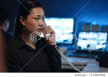 Woman Talking On The Phone In Security Post 115863806