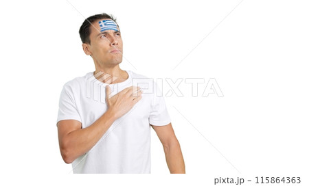 Man listening to the Greece national anthem with solemnity 115864363