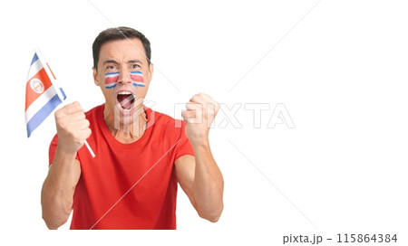 Man cheering for Costa Rica screaming and waving a national flag Man cheering for Costa Rica screaming and waving a national flag 115864384