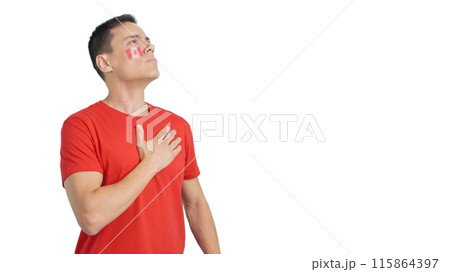 Man listening to the Canada national anthem with solemnity Man listening to the Canada national anthem with solemnity 115864397