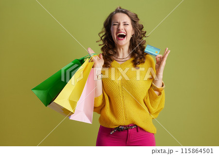 happy healthy woman isolated on green background 115864501