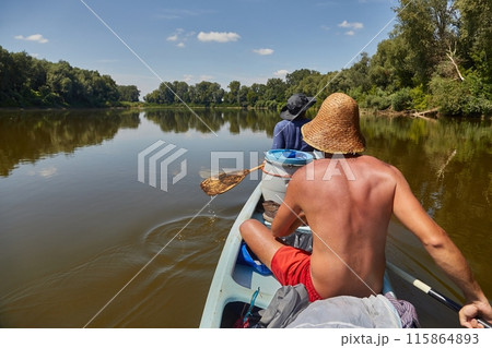 Canoe tour on a river Canoe tour on a river 115864893