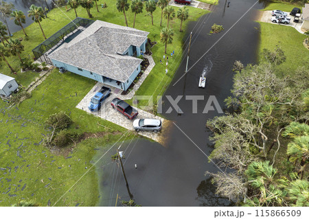 Surrounded by hurricane Ian rainfall flood waters homes in Florida residential area. Aftermath of natural disaster 115866509