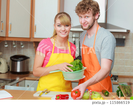 Couple preparing fresh vegetables food salad 115866519