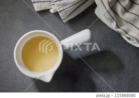 bowl of melted butter 115868080