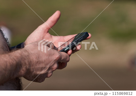 Smartphone at the beach 115869812