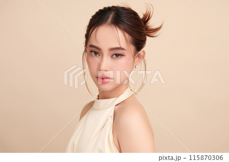 Beautiful young asian woman with clean fresh skin on beige background, Face care, Facial treatment, Cosmetology, beauty and spa, Asian women portrait. Beautiful young asian woman with clean fresh skin on beige background, Face care, Facial treatment, Cosmetology, beauty and spa, Asian women portrait. 115870306