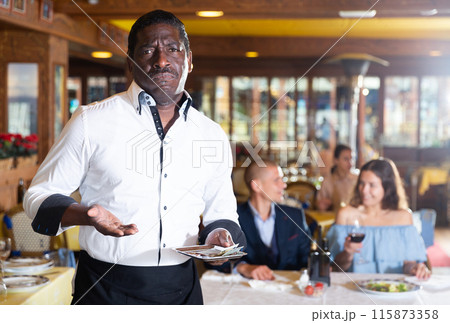 Waiter disappointed in small tip from guests Waiter disappointed in small tip from guests 115873358