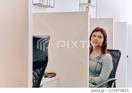 Female Call Center Agent Providing Customer Support and Assistance. 115873623