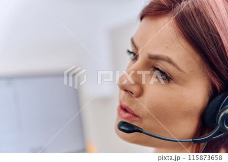 Friendly Call Center Agent Answering Incoming Calls with Headset Providing Remote Customer Service. Friendly Call Center Agent Answering Incoming Calls with Headset Providing Remote Customer Service. 115873658