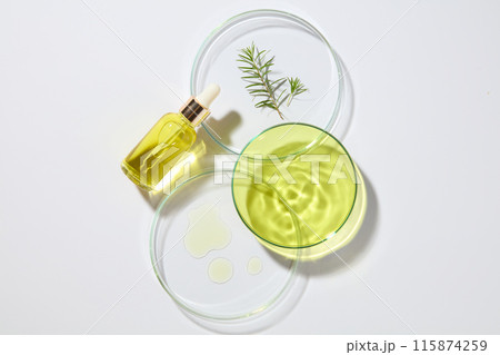 Research and development cosmetics concept with a dropper bottle decorated with three petri dishes. Natural medicine, cosmetic research, bio science, organic skin care products 115874259