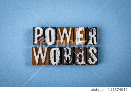 POWER WORDS. Wooden alphabet letter blocks on blue textured background 115874615