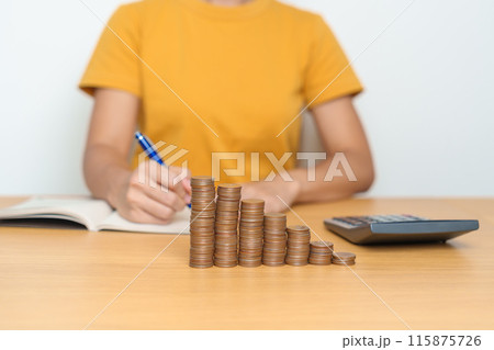 Money Saving for Future Plan, Retirement fund, Pension, Investment, Wealth Business and Financial concepts. Woman calculate and counting money coins on table Money Saving for Future Plan, Retirement fund, Pension, Investment, Wealth Business and Financial concepts. Woman calculate and counting money coins on table 115875726