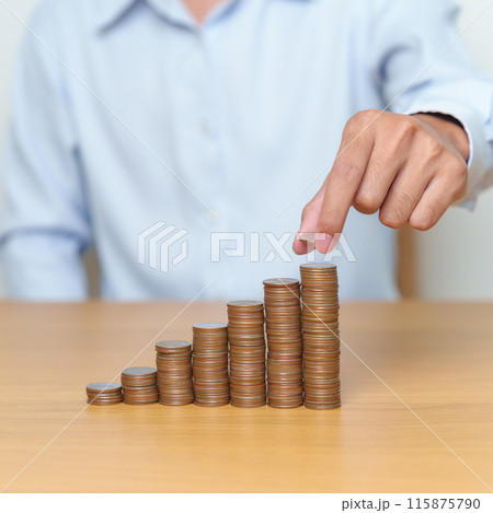 Money Saving for Future Plan, Retirement fund, Pension, Investment, Wealth Business and Financial concepts. hand putting coin into stack on table, Money counting and stack arrangement for deposit Money Saving for Future Plan, Retirement fund, Pension, Investment, Wealth Business and Financial concepts. hand putting coin into stack on table, Money counting and stack arrangement for deposit 115875790